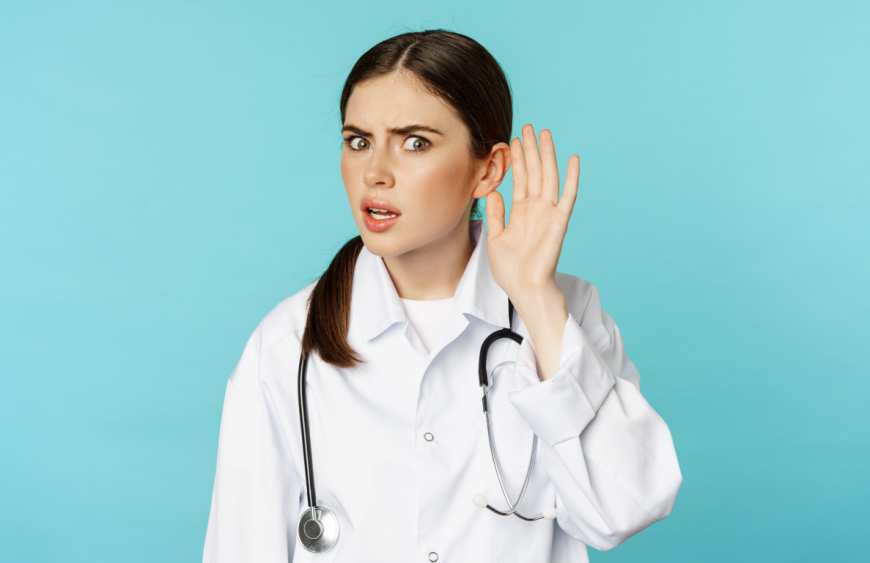 image-confused-woman-doctor-cant-hear-you-holding-hand-near-ear-looking-puzzled-speak-louder-gesture-torquoise-background-min 1