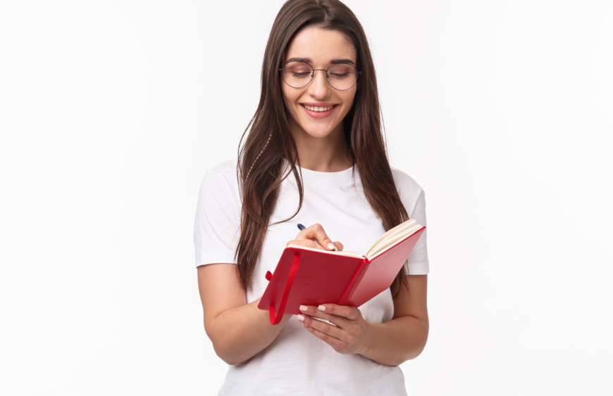 portrait-expressive-young-woman-holding-notebook-min 1